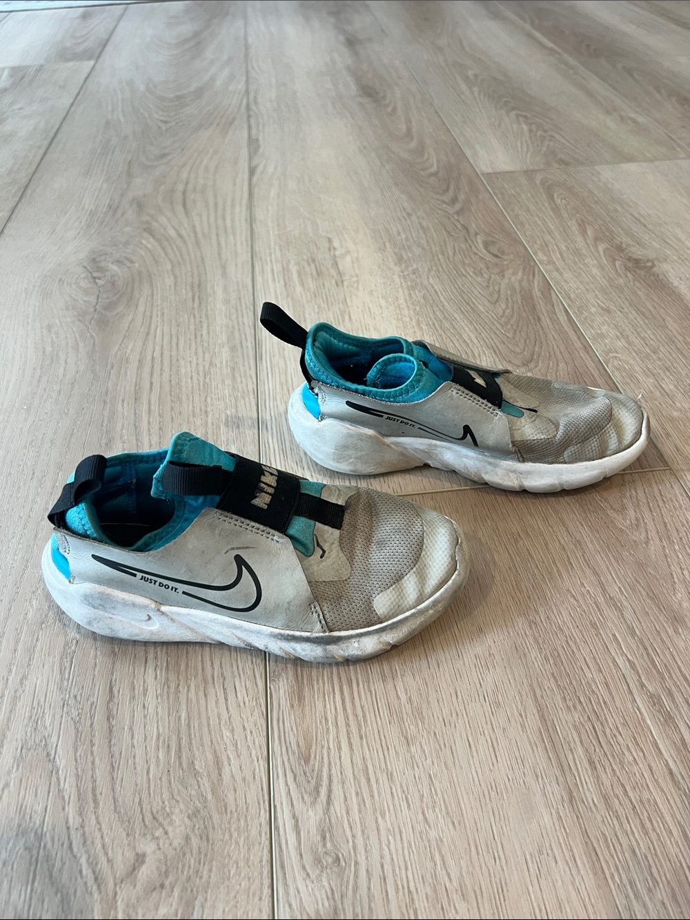 Nike Kids White and Teal Slip-On Sneakers with Black Swoosh